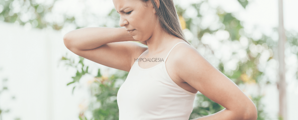 lady holding neck in discomfort