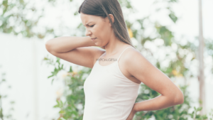 lady holding neck in discomfort