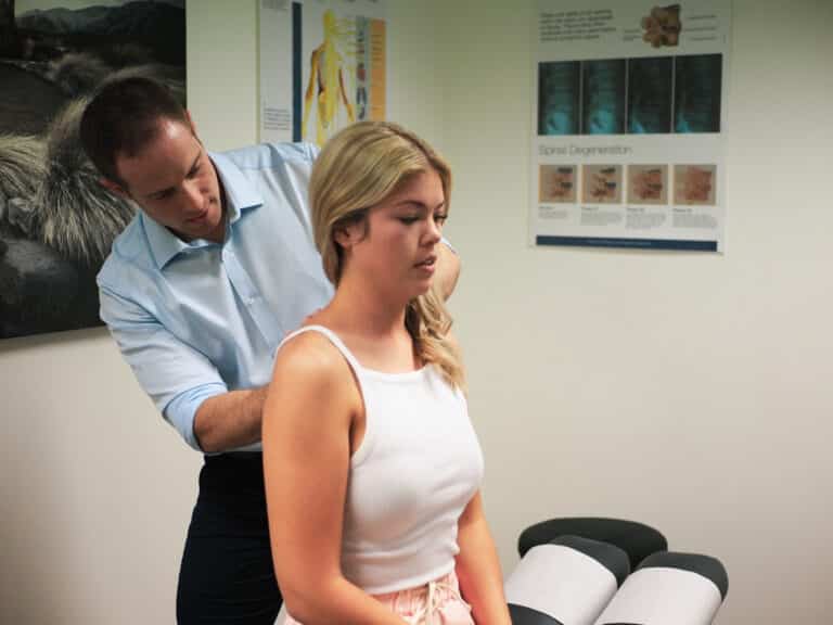 chiro working on patients back