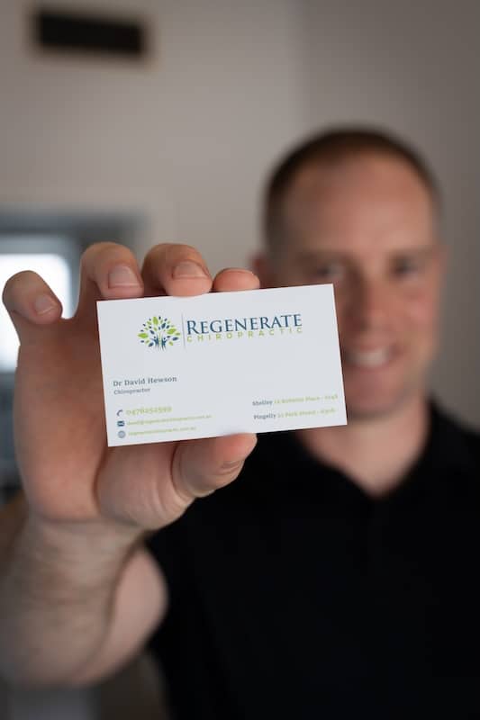 dave hewson from regenerate holding a business card
